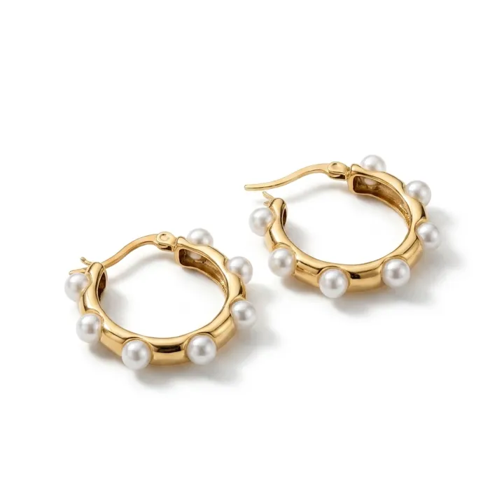 A gold and gemstone piece rendered three-quarter on a white ground.