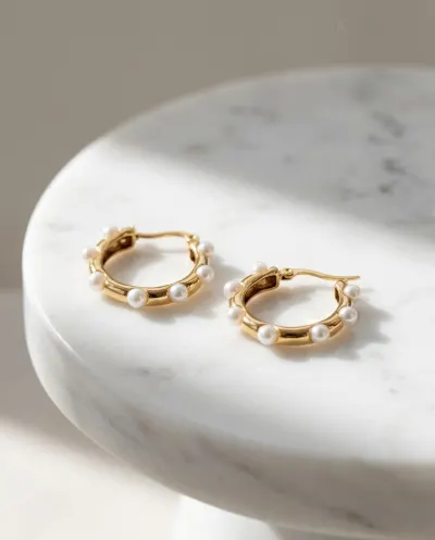 Jewellery displayed on a marble pedestal.